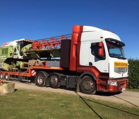 Combines & other large machines can be loaded onto a flat trailer to be transported abroad or to other parts of the country